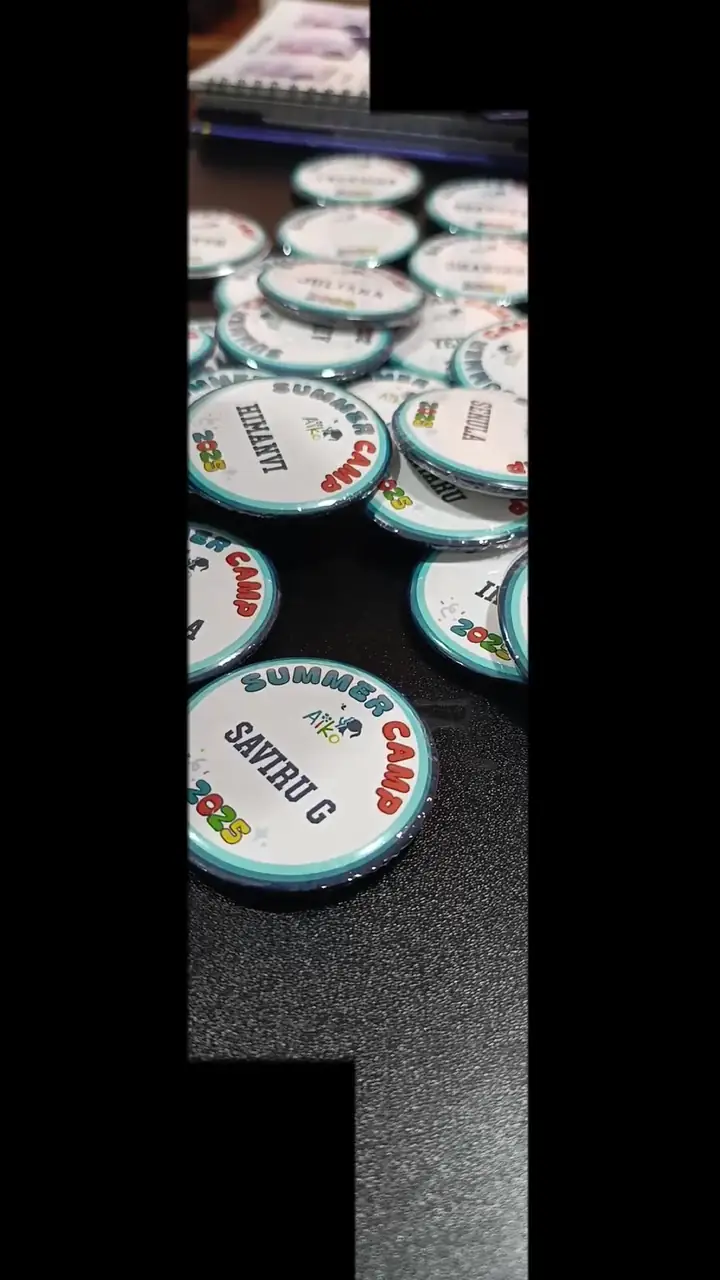 Round printed pin badges for a summer camp