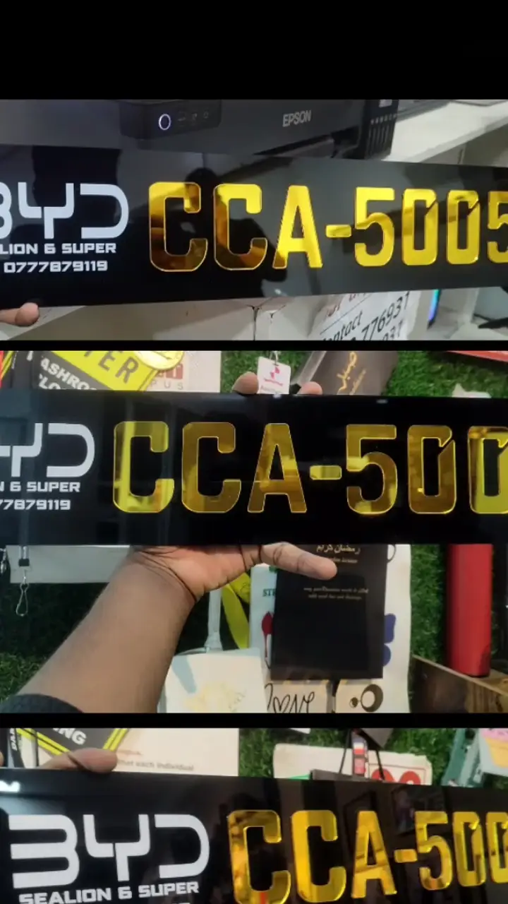 Gold lettering on black custom number plates
